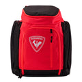 Red and black backpack with a visible brand logo on a light gray background