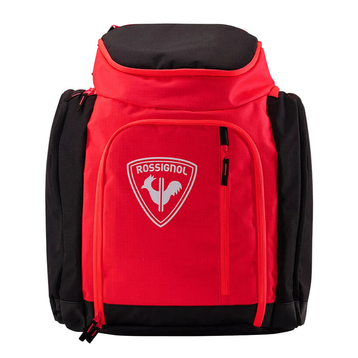 Red and black backpack with a visible brand logo on a light gray background