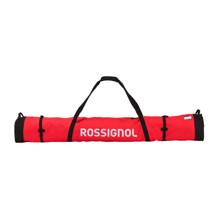 A red and black Rossignol carrying bag with white brand lettering, shown horizontally against a light gray gradient background.