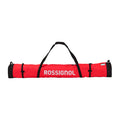 A red and black Rossignol carrying bag with white brand lettering, shown horizontally against a light gray gradient background.