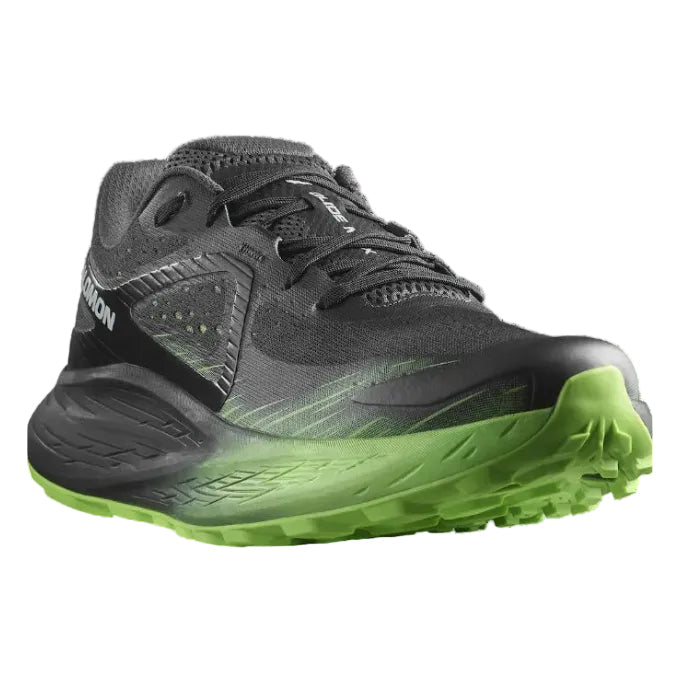 Gray running shoe with green sole on a white background