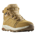 Tan hiking boot with white sole on a white background