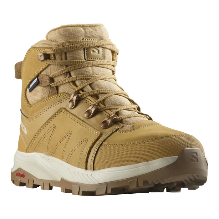 Tan hiking boot with white sole on a white background